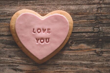 Cookies with the inscription Love you  on a wood background. Spring background. Love conceptの写真素材