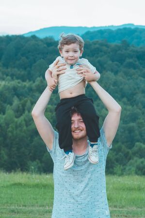 Happy loving family. Father and his son baby boy playing and hugging outdoors. Concept of Fathers...