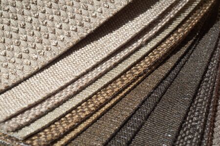 Catalog of browns multi colored cloth. Sample fabric. Industry background. Texture