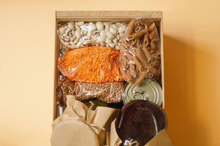 Food delivery, Donation, coronavirus. Buckwheat, pasta, canned food, lentils. View from aboveの写真素材