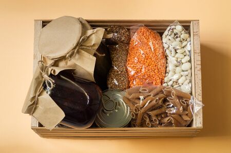 Food delivery, Donation, coronavirus. Buckwheat, pasta, canned food, lentils. View from above