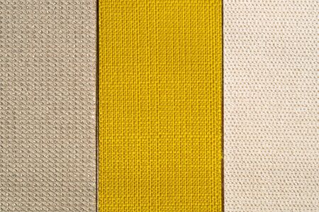 Catalog of fabric in yellow orange shades. Fabric sample. Industry background. Textureの写真素材