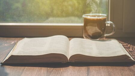 The Bible and cup coffee. Reading the bible.  Concept for faith, spirituality and religion.の写真素材