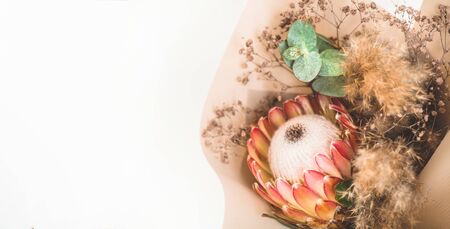 Protea flowers bunch. Protea flower close up. Holiday gift, bouquet, buds. One Beautiful fashion flowers macro shot.の写真素材