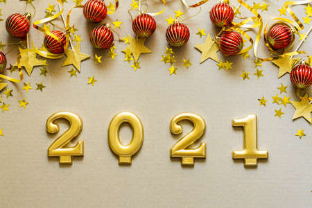 Happy New Years 2021. Christmas background with red decorations, baubles, confetti. Christmas...
