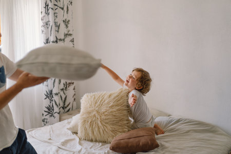 Father and his son are playing and hugging at home.の写真素材