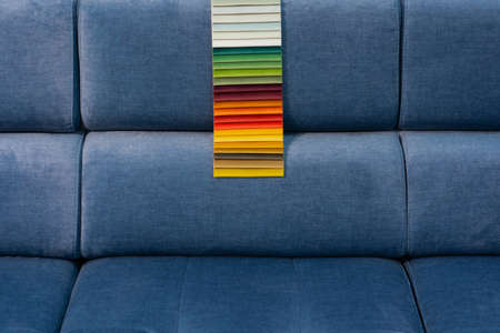 Tissue catalog. Catalog of multi-colored fabric samples. Textile industry background.