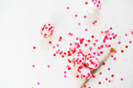Happy Easter. Easter eggs decoration pink paper confetti.の写真素材