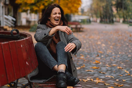 Portrait of a beautiful woman in the autumn park. Lifestyle.の写真素材