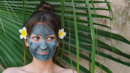 Beautiful woman applying facial mask. Wellness, healing and spa relaxation concept. Cosmetic. Lifestyleの写真素材