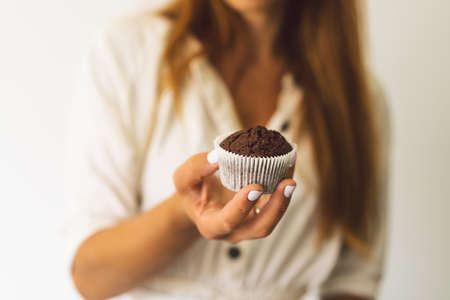 Confectioner girl is preparing a cupcakes. Concept ingredients for cooking flour products or dessertの写真素材