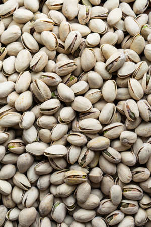 Background of organic pistachios. Natural pure pistachios nuts. Healthy eating
