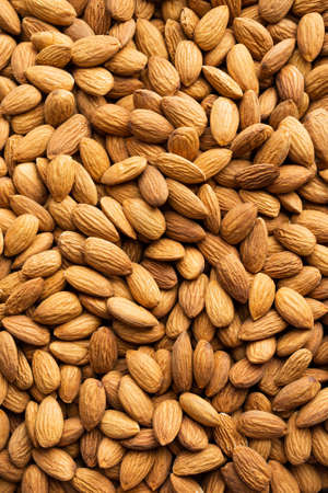 Background of organic almonds. Natural pure almond nuts. Healthy eating with food from nature