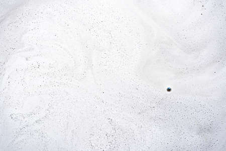 Abstract background texture of white soap foam. Chemical detergent backdrop.の写真素材