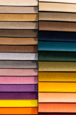 Catalog of multi-colored fabric samples. Textile industry background. Colored cotton fabric. Palet