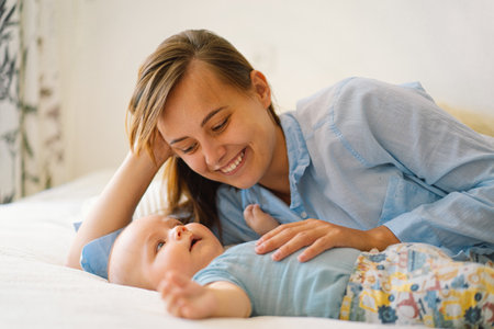 Portrait of a happy mother and child. A young mother is play with little baby boy