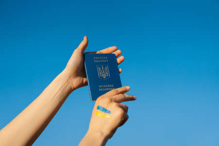 Ukrainian passport in hand ukrainian.の写真素材