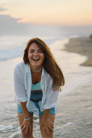 Portrait of a happy young woman on a background of beautiful sea.