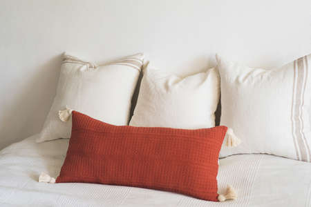 Comfortable bed with pillows in room. Modern home decor. Interior design. Template.の写真素材