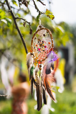 Dreamcatcher hanging on a tree. Boho chic, ethnic amuletの写真素材