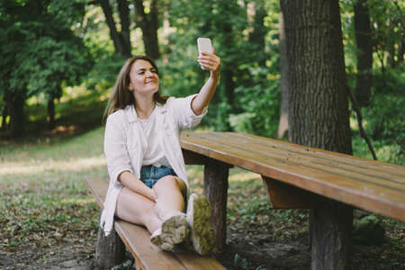 Young woman laughs and talking by video call on the phone.の写真素材