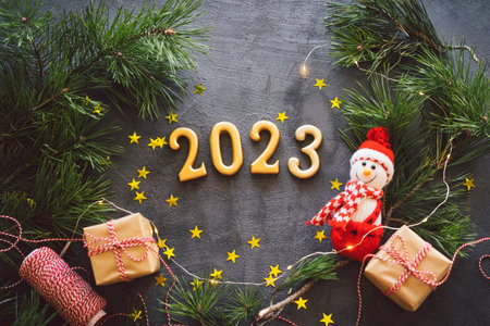 Happy New Years 2023. Christmas background with cone tree and Christmas decorations.