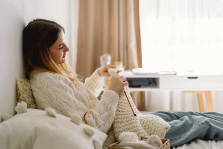 Teengirl knitting at home. Handmade and Hobby.の写真素材