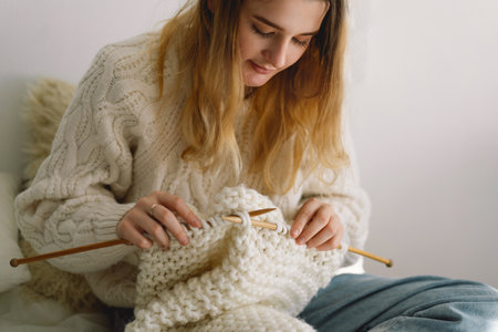 Teengirl knitting at home. Handmade and Hobby.の写真素材
