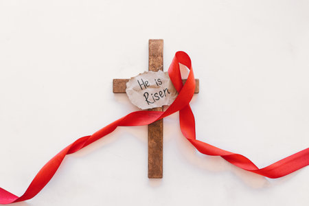 Cross with a red ribbon, a symbol of Christ. Crucifixion Of Jesus Christ. Easter Day