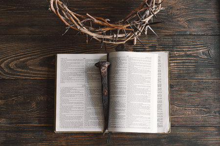 Open bible John 3:16 and thorn wreath on wooden background. Easter Day