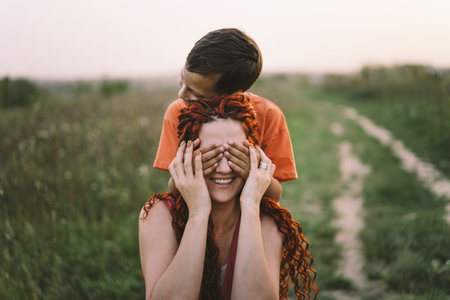 Happy mother having fun with her son outdoor. Family and love concept.の写真素材