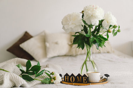Cozy home. Still life in the living room with wooden inscription home.