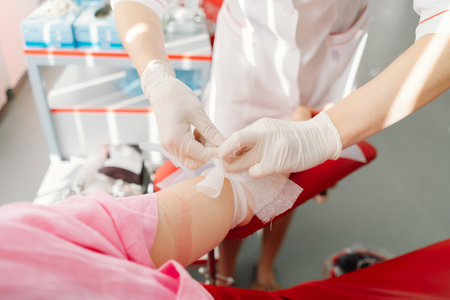 Young woman making blood donation in hospital. Blood donation.