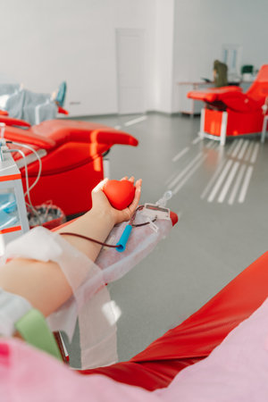 Young woman making blood donation in hospital. Blood donation.の写真素材