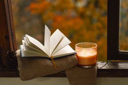 Sweater, candle and autumn decor. Autumn home decor.の写真素材