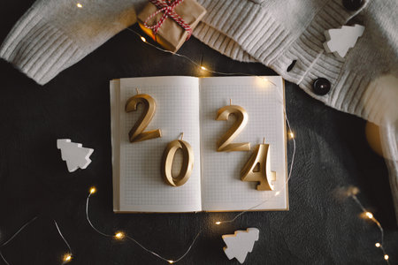 Holiday background Happy New Year 2024. Numbers of year 2024 with sweaterの写真素材