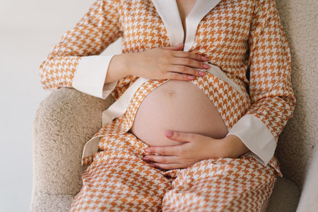 Belly of pregnant woman. Close-up belly of a pregnant woman.の写真素材