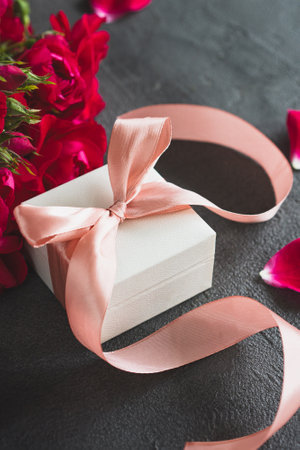 Top view white gift box, adorned with vibrant pink ribbonの写真素材