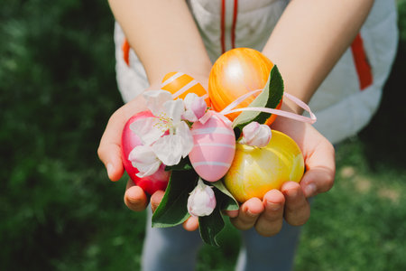 Child holding Easter eggs. Hunting for Easter eggsの写真素材