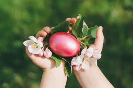 Child holding Easter eggs. Hunting for Easter eggsの写真素材