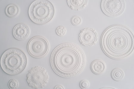 Abstract White Circular Bas-Relief Sculptures on a Clean Backgroundの写真素材