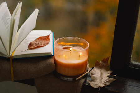 Candle and autumn decor. Autumn home decor. Cozy fall mood.の写真素材