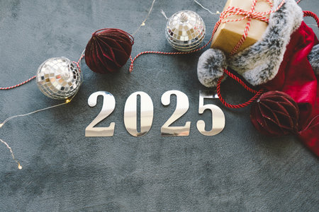 Cozy winter setup with a warm drink, festive decorations, and New Year numbers.
