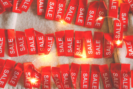 Cozy sweater adorned with holiday sale tags