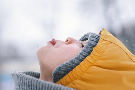 Portrait of a happy boy in winterの写真素材