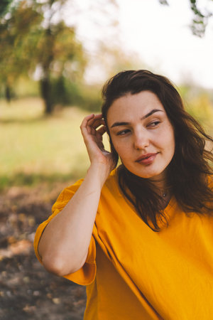 A woman enjoys a sunny day outdoors