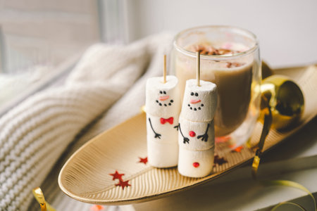 Marshmallow snowman decorated with festive accessories