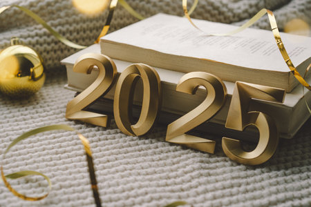 New Year celebration with golden 2025 numerals adorned with festive decorations and sparkling stars
