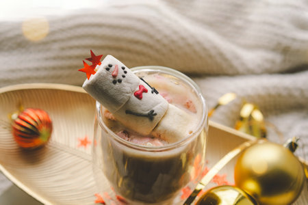 Marshmallow snowman decorated with festive accessoriesの写真素材