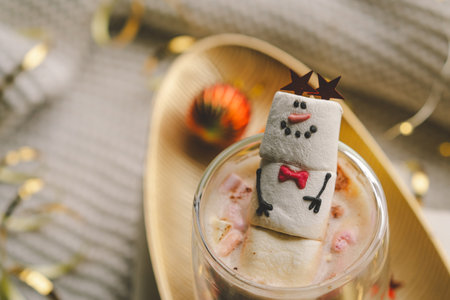Marshmallow snowman decorated with festive accessoriesの写真素材